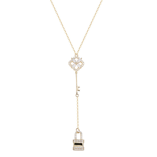 925 Sterling Silver Falling Key & Lock Necklace, plated with 14K Gold.